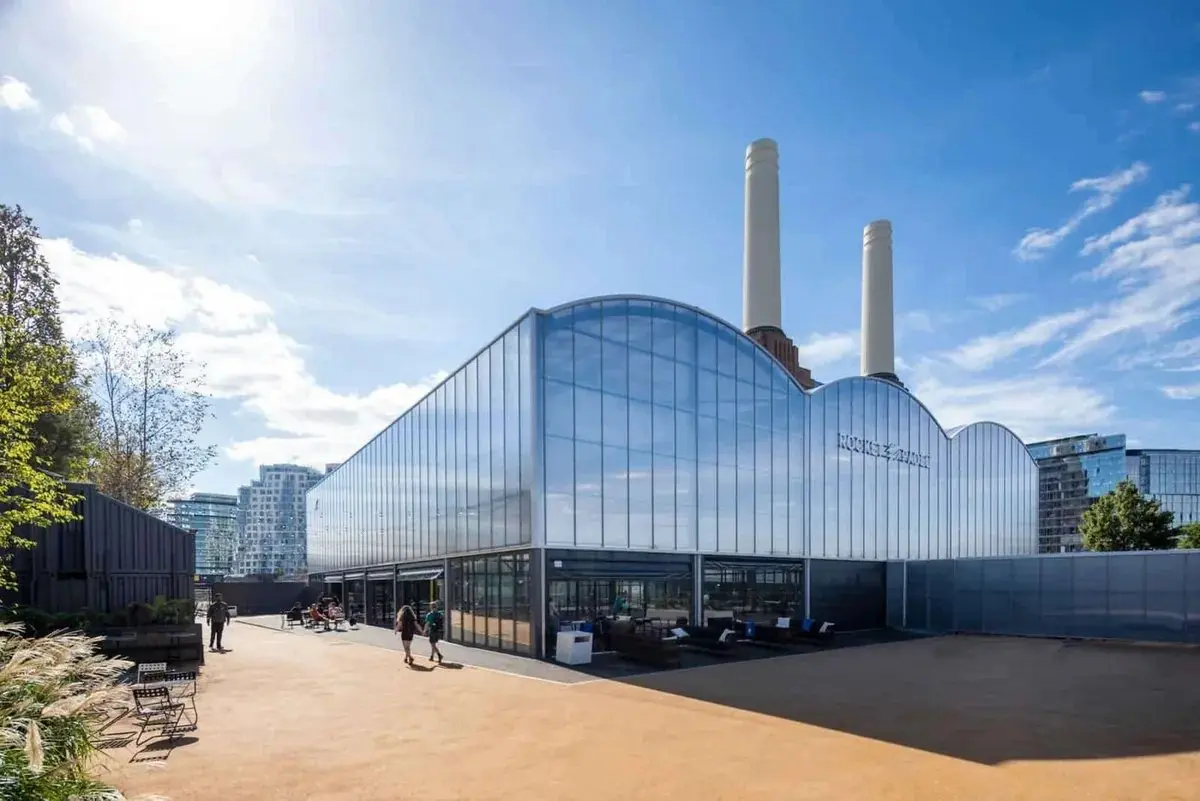 Rocket Padel glazed padel hall in front of Battersea Power Station chimneys